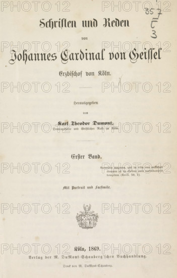 Schriften und Reden von Johannes Cardinal von Geissel Erzbischof von Köln : Erster Band, book, number: '1R118', writer (clerical worker): Johannes von Geissel, publisher: DuMont Schauberg, M., Cologne, 1869, writer (clerical worker), North Rhine-Westphalia, textile materials, pasteboard, biological material, paper, linen (material), leather, albumen print, height 223 mm x width 145 mm x thickness 30 mm, A vertically oriented aged paper page with ornate blackletter headings across the top and center, a faint decorative emblem near the lower middle, and various smaller lines of printed text arranged in centered blocks; the paper shows light stains and age spots, a hand-drawn pencil mark and numerical scribbles near the upper right, and faint horizontal discoloration banding across the page.