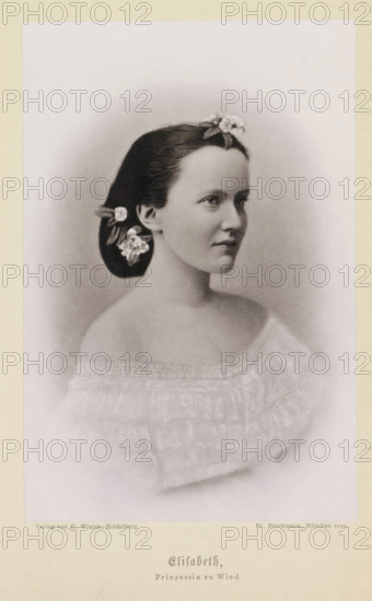 Elisabeth, Prinzessin zu Wied, Photo reproduction of a portrait of Elisabeth zu Wied as a princess, reproduction, page, photomechanical print, cliché maker: Friedrich Bruckmann, Munich, publisher: C. Winter, Heidelberg, after sculpture by anonymous, c. 1879 - in or before 1889, photographer, after sculpture by, Bavaria, Baden-Württemberg, paper, collotype, photoprint, height 153 mm x width 101 mm, Person, Elisabeth zu Wied (queen of Romania), queen, A sepia-toned portrait of a young woman shown from the shoulders up in three-quarter profile facing right, with dark hair pulled back and decorated with small flowers at the crown and near the ear, a smooth complexion, and a calm expression; she wears an off-the-shoulder, ruffled garment with delicate embroidered or lace-like trim, and the image is framed by a soft vignette against a plain background.