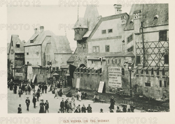 Old Vienna, on the Midway, Replicas of historic buildings at the World's Columbian Exposition in Chicago in 1893, page, photomechanical print, number: 'Plate 108', photographer: Charles Dudley Arnold, Chicago, photographer: HD Higinbotham, cliché maker: anonymous, 1893, Charles Dudley Arnold, HD Higinbotham, photographer, cliché maker, North America, Illinois, paper, collotype, photoprint, height 128 mm x width 190 mm, world fair, world exhibition, World's Columbian Exposition, A street scene shows a row of tall, old-style buildings with steeply pitched roofs, dormer windows, and decorative architectural details, including a carved relief on one facade and small turrets on the roofline; a high wall with regularly spaced battlements runs along the front of the buildings and a large ornate lamp post stands near the wall; numerous people in period clothing walk and stand in the open area in front of the wall, with some seated on chairs near the wall and small groups gathered near an entra...