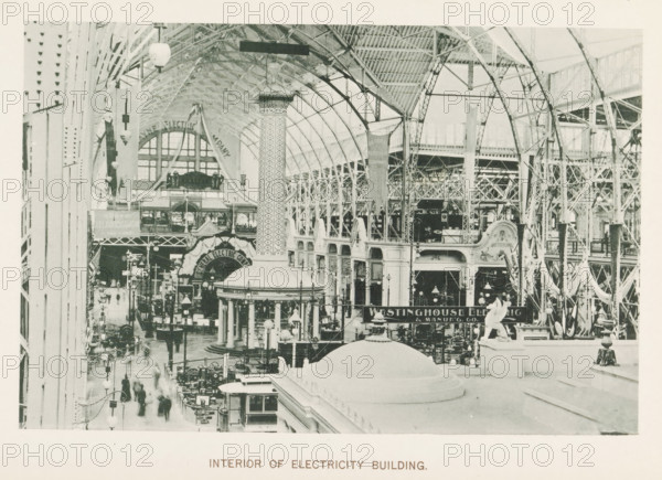 Interior of Electricity Building, Interior of the electricity building during the World's Columbian Exposition in Chicago in 1893, page, photomechanical print, number: 'Plate 30', photographer: Charles Dudley Arnold, Chicago, photographer: HD Higinbotham, cliché maker: anonymous, 1893, Charles Dudley Arnold, HD Higinbotham, photographer, cliché maker, North America, Illinois, paper, collotype, photoprint, height 125 mm x width 191 mm, world fair, world exhibition, World's Columbian Exposition, A large indoor exhibition space with a high arched metal roof supported by lattice ironwork, rows of tall columns and decorative arches along the sides, a domed round pavilion with columns near the center, a patterned tall column rising behind it, numerous hanging banners and light fixtures suspended from the ceiling, crowded aisles filled with display booths, machines, and people, ornamental sculptural elements on ledges in the foreground, and an elevated walkway and gallery running along the ri...