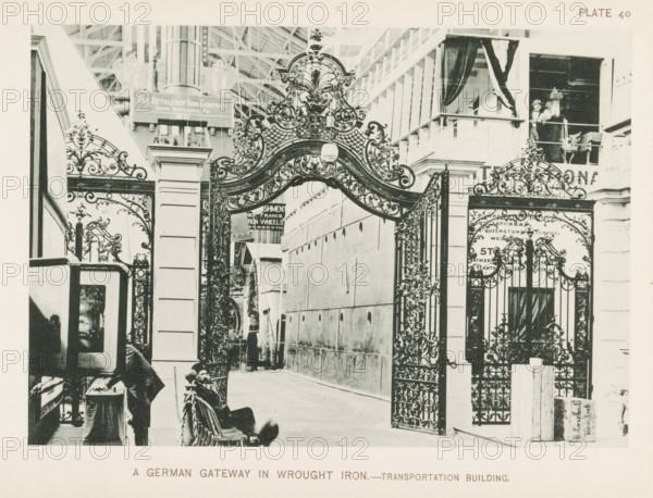 A German gateway in wrought iron.- Transportation Building, Wrought iron gate at the German exhibition in the transportation building at the World's Columbian Exposition in Chicago in 1893, page, photomechanical print, number: 'Plate 40', photographer: Charles Dudley Arnold, Chicago, photographer: HD Higinbotham, clichémaker: anonymous, 1893, Charles Dudley Arnold, HD Higinbotham, photographer, clichémaker, North America, Illinois, paper, collotype, photogravure, height 133 mm x width 190 mm, fence, wall, paling, world fair, world exhibition, World's Columbian Exposition, An ornate wrought iron gateway with intricate scrollwork and decorative flourishes spans a walkway between two stone or plaster pillars, flanked by matching iron gates with elaborate patterns; behind the gateway a corridor with a plain wall and a person standing near a cart is visible, while to the right a building façade with a balcony shows two figures partially visible behind a railing and curtains; in the foregrou...