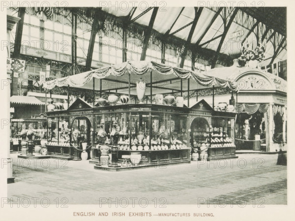 English and Irish exhibits.- Manufactures Building, Exhibition of England and Ireland in the Engineering Building during the World's Columbian Exposition in Chicago in 1893, page, photomechanical print, number: 'Plate 6', photographer: Charles Dudley Arnold, Chicago, photographer: HD Higinbotham, clichémaker: anonymous, 1893, Charles Dudley Arnold, HD Higinbotham, photographer, clichémaker, North America, Illinois, paper, collotype, photogravure, height 134 mm x width 190 mm, world fair, world exhibition, World's Columbian Exposition, A large indoor exhibition space with a central pavilion draped in decorative fabric and supported by slender posts, surrounded by display cases filled with ceramic vases, bowls, and ornamental vessels of various shapes and sizes, and several large decorative urns placed on pedestals around the perimeter; the space has a high arched glass and iron roof with visible beams and trusses, patterned windows along the upper walls, and ornate architectural details...