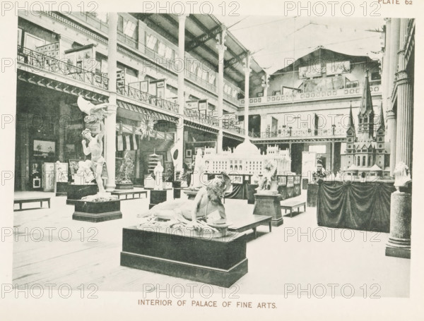 Interior of a room with sculptures and models of buildings in the Palace of Fine Arts at the World's Columbian Exposition in Chicago in 1893, Interior of Palace of Fine Arts, page, photomechanical print, number: 'Plate 62', photographer: Charles Dudley Arnold, Chicago, photographer: HD Higinbotham, cliché maker: anonymous, 1893, Charles Dudley Arnold, HD Higinbotham, photographer, cliché maker, North America, Illinois, paper, collotype, photoprint, height 134 mm x width 190 mm, piece of sculpture, reproduction of a piece of sculpture, permanent exhibition, museum, world fair, world exhibition, World's Columbian Exposition, Palace of Fine Arts, A large indoor space with tall columns and a high ceiling displays numerous sculptures, architectural models, and framed artworks arranged on pedestals and platforms; a reclining nude figure occupies a central pedestal while a standing muscular statue with an outstretched arm and an eagle figure sits nearby; a detailed model of a domed building a...