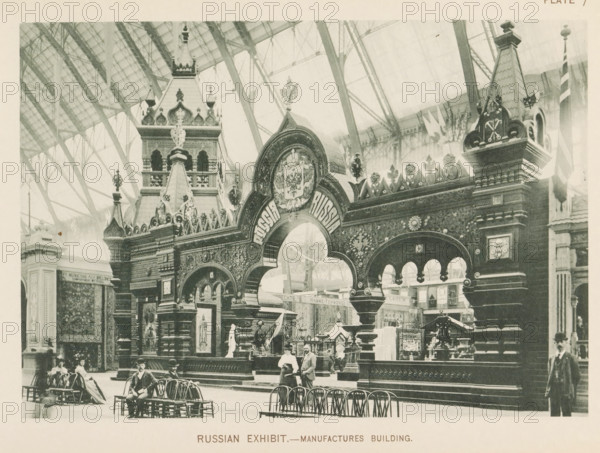 Russian exhibit.- Manufactures Building, Exhibition of Russia at the World's Columbian Exposition in Chicago in 1893, page, photomechanical print, number: 'Plate 7', photographer: Charles Dudley Arnold, Chicago, photographer: HD Higinbotham, cliché maker: anonymous, 1893, Charles Dudley Arnold, HD Higinbotham, photographer, cliché maker, North America, Illinois, paper, collotype, photoprint, height 134 mm x width 190 mm, world fair, world exhibition, World's Columbian Exposition, A large ornate archway with decorative carvings and crest-like ornamentation stands beneath a glass and iron vaulted ceiling, flanked by tall sculpted towers with finials and ornamental details; below the arch are smaller arches and decorative panels, with display cases and decorative objects visible inside the exhibit area; in front of the structure are rows of wooden chairs and a few seated figures wearing period clothing, while a couple stands near the entrance and a man in a suit and hat stands to the righ...