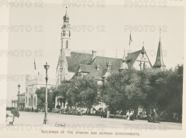 Buildings of the Spanish and German Governments, Buildings of Spain and Germany at the World's Columbian Exposition in Chicago in 1893, page, photomechanical print, number: 'Plate 72', photographer: Charles Dudley Arnold, Chicago, photographer: HD Higinbotham, cliché maker: anonymous, 1893, Charles Dudley Arnold, HD Higinbotham, photographer, cliché maker, North America, Illinois, paper, collotype, photoprint, height 134 mm x width 190 mm, world fair, world exhibition, World's Columbian Exposition, A wide street scene shows a large ornate building with steep tiled roofs, decorative gables, and several towers and spires, one tower featuring statues and a domed top and another a tall pointed spire with patterned tiling; flagpoles rise above parts of the roofline and lamp posts stand along the street in front of the building; dense trees partially obscure the lower portion of the structure and benches sit beneath the trees where many people are gathered, some seated and some standing, wit...