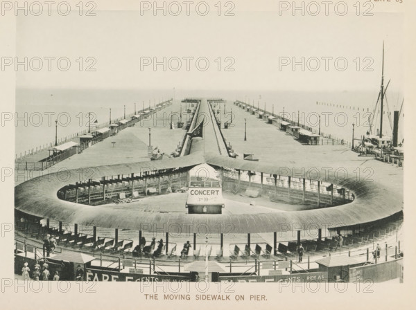The moving sidewalk on pier, View of a pier in Lake Michigan with a moving platform for the World's Columbian Exposition in Chicago in 1893, page, photomechanical print, number: 'Plate 83', photographer: Charles Dudley Arnold, Chicago, photographer: HD Higinbotham, clichémaker: anonymous, 1893, Charles Dudley Arnold, HD Higinbotham, photographer, clichémaker, North America, Illinois, paper, collotype, photogravure, height 133 mm x width 191 mm, pier, quay, wharf, world fair, world exhibition, World's Columbian Exposition, A wide wooden pier extending into the water with two long parallel walkways lined by small covered shelters and tall lamp posts, a curved wooden structure in the foreground forming a circular open area with benches and a central covered kiosk, a narrow track running from the circular area toward the pier end, people visible on the circular benches and walking near the entrance area, boats moored at the pier’s right side with tall masts, and a calm horizon where the se...