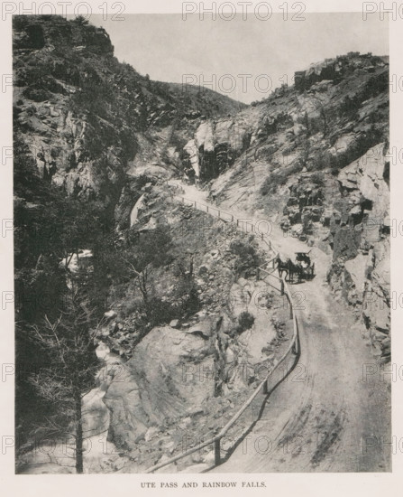 In Monument Park, View of rock formations in Monument Park in Colorado, page, photomechanical print, Monument Park, cliché maker: New York Photo-Gravure Company, New York (city), c. 1888 - in or before 1893, photographer, North America, Colorado, Las Animas, paper, autotypie, height 78 mm x width 83 mm, landscapes, ravine, chasm, abyss, canyon, A narrow dirt road winds along a rocky canyon with a wooden railing on the outer edge, steep rock walls rising on both sides and scattered vegetation clinging to the slopes, a horse-drawn carriage with a covered top and a person beside it is on the road, jagged boulders and rock ledges fill the foreground and midground, a stream cascades through rocks below with bare and leafy trees along its banks, distant hilltops are visible against a pale sky.