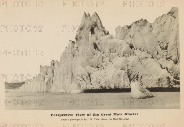 Peerspective view of the great Muir glacier, View of the Muir Glacier, page, photomechanical print, inscription: 'From a photograph by IW Taber (from the East Moraine)', photographer: Isaiah West Taber, Skagway-Hoonah-Angoon, cliché maker: anonymous, c. 1885 - in or before 1890, North America, Alaska, paper, collotype, photoprint, height 102 mm x width 175 mm, Print opposite title page., glacier, Muir Glacier, A wide, sepia-toned photograph shows a rugged ice formation rising from calm water, with jagged, towering peaks and steep, angular faces that display a variety of textured surfaces and crevices; a large detached chunk of ice floats near the base of the formation in the foreground, while the water in front appears smooth and reflective; the sky above is pale and empty, and faint distant landforms are visible at the far left edge of the image.