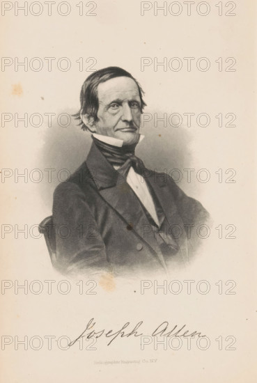 Joseph Allen, Portrait of Joseph Allen, page, photomechanical print, cliché maker: Heliographic Engraving Co., New York (city), c. 1864 - in or before 1869, photographer, North America, paper, collotype, photoprint, height 97 mm x width 75 mm, Print opposite title page., Person, historical persons, A black and white engraved portrait of a seated man shown from the waist up wearing a dark suit jacket with wide lapels, a vest, a high white collar, and a dark cravat tied at the neck, his hair dark and combed back with slight waves, his face long with pronounced cheekbones and a neutral expression, the background shaded around the figure fading into a lighter plain area, and some small stains and spots visible on the paper.