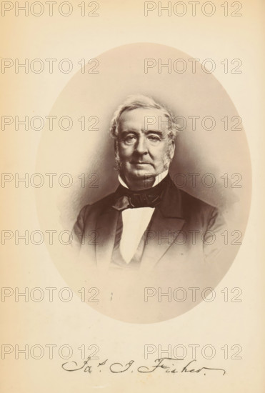 Photo reproduction of a portrait of James Isom Fisher, Yes. I. Fisher, photograph, reproduction, page, photographer: Bendann Bros., after design by anonymous, c. 1866 - in or before 1871, paper, albumen print, height 147 mm x width 110 mm, Person, James Isom Fisher, historical persons, A sepia-toned oval portrait of an older man shown from mid-chest upward, with light-colored hair styled back and sideburns, a serious facial expression, and visible facial wrinkles; he wears a dark formal coat with lapels, a dark bow tie, and a light-colored shirt front; the portrait is centered on a pale background with a faint vignette around the oval and a section of cursive handwriting visible below the portrait.