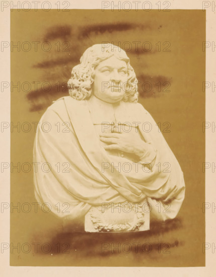 Marble bust of Mayor Johannes Munter by Bartholomeus Eggers, Marble Bust of Mayor Joh. Munter, by B. Eggers, photograph, page, number: 'No. 479*.', photographer: Pieter Oosterhuis, Amsterdam, 1876, paper, albumen print, height 166 mm x width 126 mm, Person, Johannes Munter, piece of sculpture, reproduction of a piece of sculpture, Historical Exhibition Amsterdam, Oudemannenhuis (Amsterdam), Period, A sepia-toned photograph of a marble bust showing a person with long curly hair and a solemn facial expression wearing draped robes, one hand placed on the chest and the other partly visible beneath the folds, with carved decorative elements at the base and a plain background with darker smudged areas.
