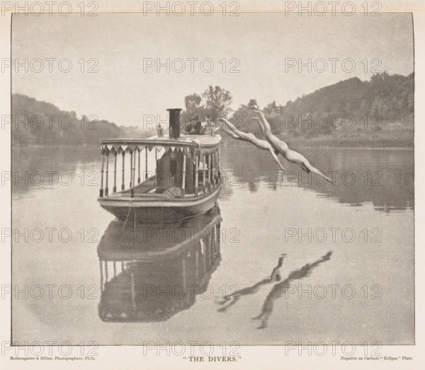 The Divers', Two men dive from a boat into the water, page, photomechanical print, inscription: 'Negative on Carbutt 'Eclipse' Plate.', name: 'Kurtz', photographer: Rothengatter & Dillon, North and Central America (possibly), cliché maker: anonymous, c. 1884 - in or before 1889, Rothengatter & Dillon, photographer, cliché maker, North and Central America, paper, autotype, height 125 mm x width 148 mm, adult man, steamship, motorship, diving (movement in water), A boat with decorative railings sits on calm water near tree-lined shores, its reflection visible on the water surface, and three nude figures are shown mid-dive arcing away from the boat toward the water with their reflections faintly mirrored below.
