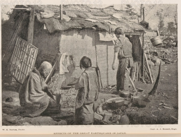 View of three people near a hut in Japan, Effects of the great earthquake in Japan, page, photomechanical print, photographer: William Kinnimond Burton, Japan, cliché maker: Andrew Joseph Russell, 1887 - 1907, paper, autotypie, height 113 mm x width 164 mm, anonymous historical persons depicted in a group, in a group-portrait, hut, cabin, lodge, consequences of an earthquake, An outdoor scene in front of a simple shelter with a thatched roof and fabric covering shows five people in worn clothing; an elderly seated person with a shaved head and draped garment looks downward while holding a tool, a child standing nearby faces the shelter, a taller youth stands with a hand raised toward the roof, another person crouches near a pile of long poles leaning against the structure, and a figure sits partially obscured among scattered household items including pots, pans, baskets, and bundles; the ground is uneven with debris and the shelter’s walls appear patched with cloth and boards.