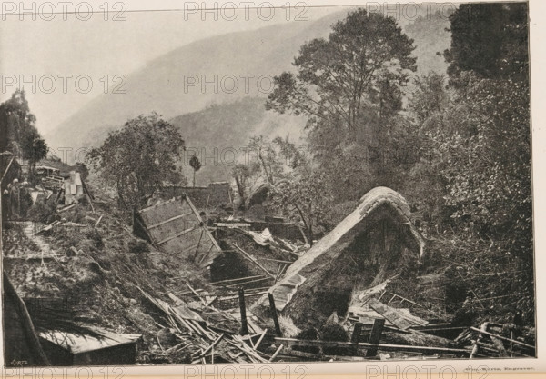 View of the devastation in a village after an earthquake in Japan, Effects of the great earthquake in Japan, page, photomechanical print, inscription: 'Kurtz', photographer: William Kinnimond Burton, Japan, cliché maker: Kurtz, 1887 - 1907, paper, autotypie, height 115 mm x width 172 mm, consequences of an earthquake, A black-and-white photograph showing a landscape with broken wooden structures and scattered debris in the foreground, including planks, beams, and tilted panels partially buried in earth and vegetation. A large curved mound covered in thatch or similar material rises amid the wreckage. Trees with dense foliage stand behind the ruined area, and taller trees extend upward toward a hazy, sloping hillside in the background. On the left edge, a few small figures stand near more damaged wooden constructions and foliage. The scene is framed by a narrow border at the top and bottom.
