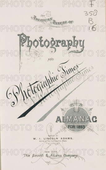 The American annual of photography and photographic times almanac for, book, annotation: '95580, 300, -, ... cataloge photographicus', date: 'May 1998', editor (person who revises): Washington Irving Lincoln Adams, publisher: Scovill and Adams, New York (city), 1887 - 1907, editor (person who revises), North America, textile materials, paper, linen (material), transparent paper, printing, daylight gelatin silver print, autotype, collotype, height 249 mm x width 153 mm x thickness 39 mm, A cream-colored page with ornate dark gray ornamental lettering and decorative flourishes arranged in a vertical layout, featuring a large stylized title in an elaborate serif script near the top, swirling calligraphic embellishments and a diagonal decorative ribbon crossing the center, a circular ornate emblem with a textured interior and ornamental scrollwork near the lower right, delicate filigree elements and flourishes scattered across the page, and a small column of handwritten numerals and marks ...