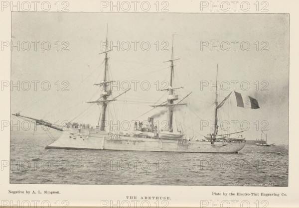 The Arethuse, page, photomechanical print, photographer: AL Simpson, cliché maker: Electro-Tint Engraving Co., c. 1888 - in or before 1893, paper, autotype, height 102 mm x width 163 mm, ships (in general), A large naval ship is shown afloat on calm water, photographed from its side; the vessel has a long hull with gun ports and a raised forecastle, two tall masts with spars and rigging, and a shorter mast toward the stern. Several figures stand on the deck and near a central superstructure with funnels and equipment. A long bowsprit projects forward over the water. A flag with vertical dark and light panels flies from a mast near the stern. The sky is pale and uniform, and another smaller vessel appears in the distant background on the right.