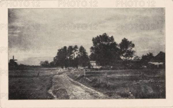 View of a country road, page, photomechanical print, photographer: Hugo Henneberg, cliché maker: Wilhelm Knapp Verlag, Halle an der Saale, c. 1893 - in or before 1898, printer (person), Saxony-Anhalt, paper, autotypie, height 99 mm x width 168 mm, meadow, pasture, public road, A grainy black-and-white scene shows a winding dirt path leading away from the foreground toward a cluster of trees and small buildings in the middle distance, with low fences lining the path and enclosing grassy fields on either side, tall trees with dense foliage silhouetted against a cloudy sky, a small timber-framed structure partially visible among the trees, and a windmill shape faintly visible near the horizon at the left.
