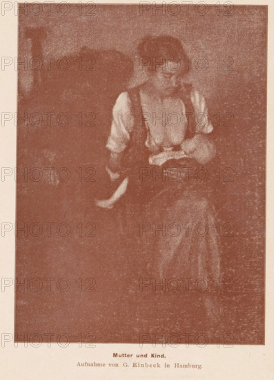 Portrait of an unknown woman with a child at the breast, Mutter und Kind, page, photomechanical print, photographer: George Einbeck, cliché maker: anonymous, printer (person): Wilhelm Knapp Verlag, Halle an der Saale, c. 1893 - in or before 1898, printer (person), Saxony-Anhalt, paper, autotypie, height 164 mm x width 121 mm, Print page opposite 240., mother and baby or young child, A sepia-toned image shows a seated woman holding a small child in her lap; the woman wears a light blouse with darker straps and looks down toward the child, whose head rests near her chest while one small leg extends outward; the background is mostly dark and textured, and the scene is framed with a narrow border.