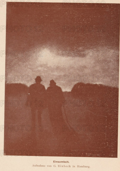 View of two unknown walking men with hats, Einsamkeit, page, photomechanical print, monogram: 'MR, &Co', photographer: George Einbeck, cliché maker: Meisenbach, Riffarth & Cie. (possibly), Berlin, printer (person): Wilhelm Knapp Verlag, Halle an der Saale, c. 1893 - in or before 1898, printer (person), Saxony-Anhalt, paper, autotypie, height 164 mm x width 120 mm, mother and baby or young child, A grainy sepia image showing a dark sky with lighter clouded area near the center and a silhouetted horizon, with two shadowy human figures standing close together in the foreground wearing hats, their forms contrasted against the lighter band of sky above the horizon.