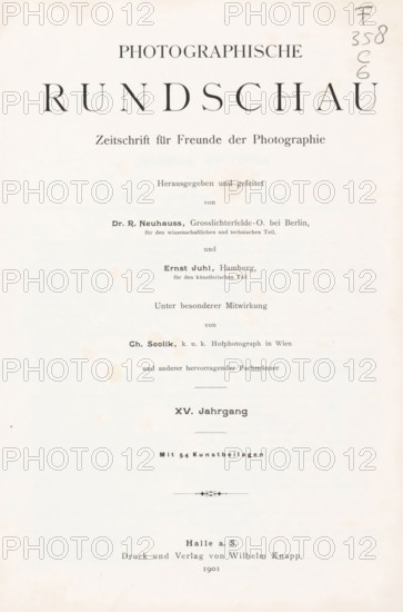Photographische Rundschau : Zeitschrift für Freunde der Photographie, magazine, annotation: 'Emil .ux, 1901', editor (person who revises): Richard Neuhauss, editor (person who revises): Ernst Juhl, printer (person): Wilhelm Knapp, Halle an der Saale, 1901, editor (person who revises), printer (person), Saxony-Anhalt, textile materials, pasteboard, biological material, paper, linen (material), leather, printing, autotype, photoaquatint, cut marble, stone marbled paper, height 275 mm x width 208 mm x thickness 35 mm, A vertically oriented aged paper page with dark printed lines and headings arranged down the center, featuring large bold serif characters near the top, smaller serif lines below, several horizontal separators, a small decorative flourish near the lower middle, and light brown spotting and foxing marks scattered across the surface, with a pencil notation along the right upper edge.