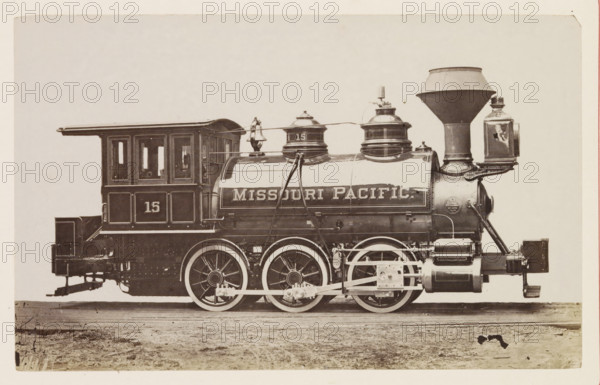American steam locomotive, photograph, page, United States of America, c. 1871 - in or before 1881, photographer, North America, paper, albumen print, height 125 mm x width 200 mm, Photo on page 144., steam locomotive, A sepia-toned photograph of a steam locomotive shown in profile, featuring a cab with windows and paneled sides, a cylindrical boiler with domed fittings and a large funnel-shaped smokestack, a lantern mounted near the front, visible piping and handrails along the boiler, large spoked driving wheels with connecting rods and mechanical linkages, a rectangular rear platform and buffer, and a ground surface beneath the rails.