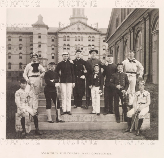Various uniforms and costumes, photograph, page, photographer: Edward H. Hart, United States Naval Academy, cliché maker: The Photo-gravure Co., New York (city), c. 1885 - in or before 1890, North America, Maryland, Annapolis, paper, collotype, photoprint, height 180 mm x width 210 mm, officer, (military) uniforms, anonymous historical persons depicted in a group, in a group-portrait, A group of men posed on outdoor stone steps in front of a large brick building with arched windows, the men wearing a variety of dark jackets, light trousers, hats, and caps, with some holding sporting equipment like a tennis racket, a long wooden bat, and a rifle, and two men seated at the lower corners while others stand on the steps, the background showing a multi-story masonry building with many windows and a tower.