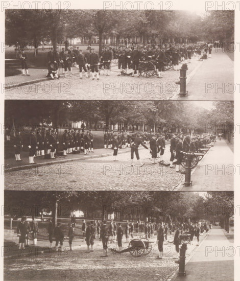 Three views of a military parade on the grounds of the United States Naval Academy in Annapolis, photograph, page, photographer: Edward H. Hart, United States Naval Academy, cliché maker: The Photo-gravure Co., New York (city), c. 1885 - in or before 1890, North America, Maryland, Annapolis, paper, collotype, photoprint, height 208 mm x width 176 mm, military parade, pageant, military academy, A sepia-toned photograph showing a tree-lined cobblestone street with rows of uniformed men standing and marching along the curb, several small wheeled cannons positioned on the roadway, some men holding poles or flags, groups of men clustered near the trees and on the sidewalk, a cast-iron fire hydrant or post visible near the curb, and buildings partially visible through the trees in the background.