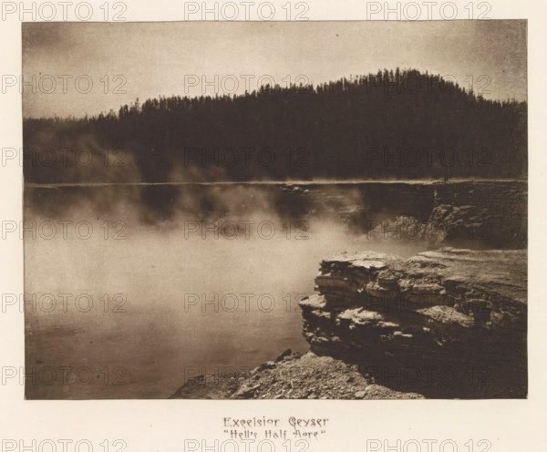 Excelsior Geyser 'Hell's Half Acre', page, photomechanical print, photographer: Frank Jay Haynes, Yellowstone National Park, cliché maker: The Photo-gravure Co., New York (city), c. 1882 - in or before 1887, Frank Jay Haynes, The Photo-gravure Co., photographer, cliché maker, North America, paper, photoaquatint, height 164 mm x width 220 mm, hot spring, geyser, Excelsior Geyser, A sepia-toned photograph showing a misty expanse of water in the foreground with rising steam or fog, a rocky cliff edge in the lower right with layered rock formations, and a dark tree-covered ridge silhouette across the upper portion of the image.