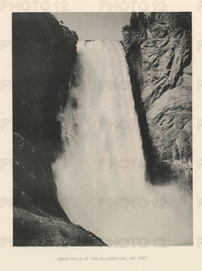 Great falls of the Yellowstone, 360 feet, page, photomechanical print, photographer: Frank Jay Haynes, Yellowstone National Park, cliché maker: The Photo-gravure Co., New York (city), c. 1886 - in or before 1891, North America, paper, collotype, photoprint, height 215 mm x width 165 mm, waterfall, Lower Yellowstone Falls, A large vertical waterfall cascading between dark rock cliffs, with mist rising where the water meets the base, jagged textured rock faces visible to the right and shadowed cliff surfaces to the left, and a sloping rocky foreground at the bottom edge.