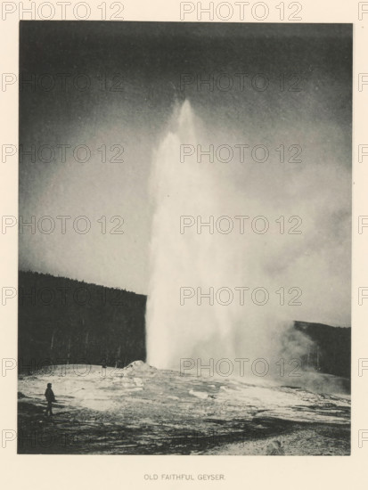 Old Faithful Geyser, page, photomechanical print, photographer: Frank Jay Haynes, Yellowstone National Park, cliché maker: The Photo-gravure Co., New York (city), c. 1886 - in or before 1891, North America, paper, collotype, photoprint, height 215 mm x width 165 mm, hot spring, geyser, Old Faithful, A tall column of steam and water rises from a ground opening, creating a bright, vertical plume that dominates the center of the image, with mist spreading outward near its base and fading into a darker sky above, a silhouette of a treeline visible along the horizon to the left, a textured rocky foreground with patches of lighter mineral deposits, and a solitary figure standing on the left edge of the foreground looking toward the plume.
