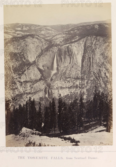 The Yosemite Falls, from Sentinel Dome, photograph, page, number: 'XI.', photographer: Carleton E. Watkins, Yosemite Valley, c. 1860 - in or before 1868, North America, California, paper, albumen print, height 206 mm x width 156 mm, waterfall, mountains, dale, valley, Yosemite National Park, Yosemitewaterval, A sepia-toned vertical photograph showing a steep rocky valley with a tall, narrow waterfall cascading down a cliff face toward a lower drop, surrounding rock formations with textured surfaces and scattered trees on the slopes, a dense stand of conifer trees in the foreground on a snowy slope, a distant ridgeline of rounded hills under a pale sky, and a light border around the image.