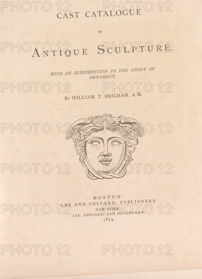 Cast catalog of antique sculpture with an introduction to the study of ornament, book, publisher: Lee and Shepard, Boston (Massachusetts), publisher: Lee, Shepard, and Dillingham, New York (city), 1874, North America, Massachusetts, textile materials, pasteboard, paper, linen (material), albumen print, height 305 mm x width 250 mm x thickness 20 mm, A faded page with a centered decorative title layout on a light beige background, featuring a large classical-style engraved face with stylized wavy hair and winged elements above the forehead, surrounded by ornamental lines, and several lines of printed text above and below the engraving in a dark serif type.