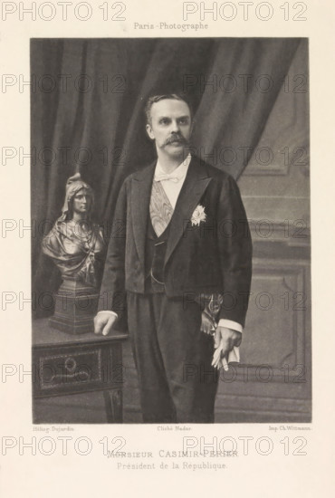 Portrait of Jean Casimir-Perier, Monsieur Casimir-Perier. Prèsident de la République, page, photomechanical print, photographer: Félix Nadar, Paris, cliché maker: Dujardin, France, printer (person): Charles Wittmann, c. 1884 - in or before 1894, printer (person), paper, photoaquatint, height 146 mm x width 105 mm, Person, Jean Casimir-Perier, politician, eg party leader, A monochrome portrait of a man standing beside a table with a sculpted bust on it; the man wears a dark formal jacket with a light bow tie and a sash across his chest, a decorative star pinned to his jacket, and holds a pair of gloves in one hand while the other hand rests on the table; behind him are heavy draped curtains and paneled wall details, and the sculpted bust depicts a robed female figure on a square base.