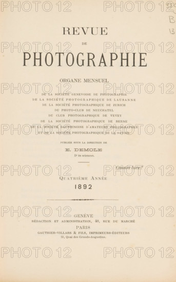Revue de photographie, book, annotation: 'JAN, 1995', editor (person who revises): Eugène Demole, c. 1892, editor (person who revises), pasteboard, paper, textile materials, printing, collotype, photoaquatint, cocoa marbled paper, height 245 mm x width 168 mm x thickness 30 mm, A cream-colored page with centered rows of printed dark serif lettering of various sizes arranged down the upper and middle area, a small decorative horizontal ornament about halfway down, and faint pencil marks at the top right; the paper shows slight discoloration and small spots near the edges.