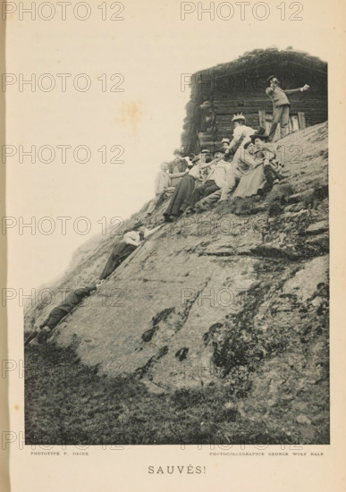 Group of people climbing a rock wall, Sauvés!, page, photomechanical print, maker: P. Odier, maker: George Wolf, c. 1892 - in or before 1897, paper, autotypie, height 160 mm x width 119 mm, adult woman, adult man, rock formations, A black-and-white photograph showing a steep rocky slope with a group of people clustered near the top beside a wooden log structure; several adults in period clothing and hats are seated and leaning against the rock while others appear to reach or hold each other; one person stands near the building with an arm extended outward, and another person higher on the slope leans forward; two figures are positioned lower on the incline, one lying and one reaching upward; the rock surface shows textured striations and patches of vegetation, and the top edge of the image has a pale sky.