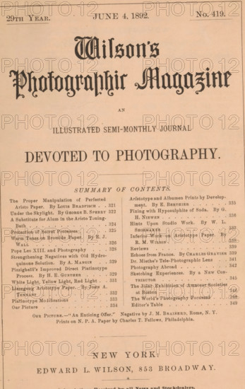 Wilson's photographic magazine, magazine, publisher: Edward Livingston Wilson, New York (city), 1892-06-04, Edward Livingston Wilson, publisher, North America, paper, printing, wood engraving, autotype, albumen print, height 255 mm x width 175 mm x thickness 4 mm, The image shows the upper portion of a printed periodical page on aged beige paper with a decorative masthead in a dark ornate typeface centered near the top and a large bold headline beneath it; beneath the headline is a horizontal rule and a centered subheading in smaller type. The page is divided into two narrow columns of body text made up of short entries with varied line lengths and small decorative separators, separated by a vertical space; the left column is aligned to the left margin and the right column to the right margin. A thin rectangular border runs near the outer edges of the page, and faint creases and small spots are visible on the paper surface. Near the lower portion of the visible area there is a wider ho...