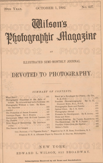 Wilson's photographic magazine, magazine, publisher: Edward Livingston Wilson, New York (city), 1892-10-01, Edward Livingston Wilson, publisher, North America, paper, printing, wood engraving, autotype, albumen print, height 256 mm x width 176 mm x thickness 4 mm, A sepia-toned page showing a magazine cover with a decorative title in a blackletter style centered near the top, a subtitle in a simpler serif font beneath it, a large bold headline in uppercase across the middle, and a horizontal rule below; a two-column list of short entries and headings fills the lower portion with small serif type, and a centered city line and publisher line appear toward the bottom in larger serif capitals; the page has a thin border, some small stains and faint pencil marks on the left, and the overall paper shows age with slight discoloration.