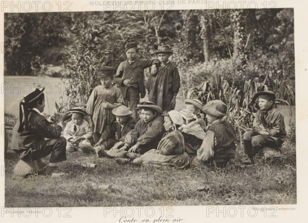 Conte en plein air, Boy telling a story to a group of children on a field, page, photomechanical print, inscription: 'Bulletin du Photo-Club de Paris', maker: Paul Géniaux, cliché maker: Lemercier, c. 1888 - in or before 1893, paper, collotype, photoprint, height 113 mm x width 169 mm, park, child between toddler and youth (of undetermined sex), story teller, listening to story teller, A sepia-toned photograph shows a group of children outdoors seated and standing on grass near tall plants and trees, many wearing hats and simple clothing; some children sit cross-legged while others kneel or stand, a few wear bonnets or caps and one child in the foreground gestures with their hands toward the seated group, while the background features dense foliage and a body of water partially visible at the left edge.