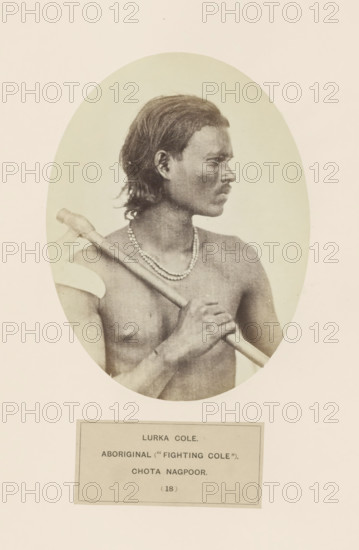 Potrait of an unknown man from the Ho tribe of Chota Nagpur in eastern India, photograph, page, The Ho tribe is also known as Lurka Kol., inscription: 'LURKA COLE., ABORIGINAL ('FIGHTING COLE')., CHOTA NAGPOOR.', number: '(18)', photographer: Benjamin Simpson (possibly), Chota Nagpur, c. 1858 - in or before 1868, Jharkhand, paper, albumen print, height 160 mm x width 120 mm, human races, peoples, nationalities, A sepia-toned oval portrait of a shirtless man shown in profile facing right, with medium-length dark hair, a mustache, and a beaded necklace, holding a long-handled object across his shoulder with one hand gripping the shaft and the other resting lower on the shaft, set against a plain light background and mounted on a larger pale sheet.