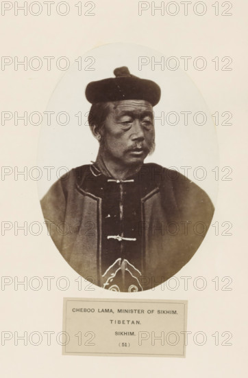 Portrait of a minister of Sikkim, photograph, page, inscription: 'CHEBOO LAMA, MINISTER OF SIKHIM., TIBETAN., SIKHIM.', number: '(51)', photographer: Benjamin Simpson (possibly), Sikkim, c. 1858 - in or before 1868, paper, albumen print, height 173 mm x width 127 mm, human races, peoples, nationalities, An oval-framed sepia portrait of an older man shown from the chest up wearing a dark rounded hat and a dark robe with lighter trim and decorative fastenings, his face turned slightly to the side with a neutral expression, visible facial hair including sideburns and a mustache, and a plain light background surrounding the oval.