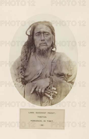 Portrait of a Buddhist priest from Tibet, photograph, page, inscription: 'LAMA (BUDDHIST PRIEST)., TIBETAN., PEMIANCHI, IN TIBET.', number: '(52)', photographer: Benjamin Simpson (possibly), Tibet, c. 1858 - in or before 1868, paper, albumen print, height 175 mm x width 129 mm, human races, peoples, nationalities, priest, Hinduism, Buddhism, Jainism, A sepia-toned oval portrait of an older man with long hair and a braided section draped over one shoulder, wearing layered robes and holding a set of beaded prayer beads in his hands, with a close-framed view showing facial hair, visible wrinkles, and a neutral expression against a pale background.