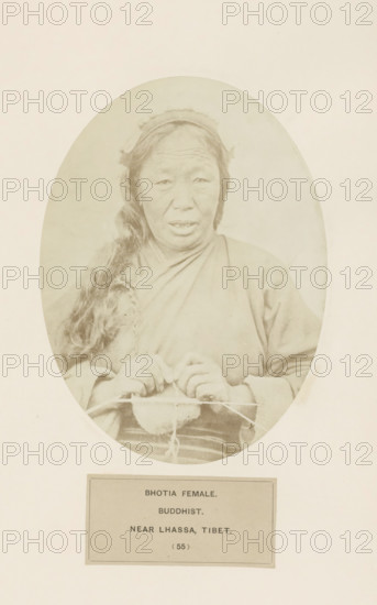 Portrait of an unknown knitting woman from the Bhutia community near Lhasa in Tibet, photograph, page, inscription: 'BHOTIA FEMALE., BUDDHIST., NEAR LHASSA, TIBET', number: '(55)', photographer: Benjamin Simpson (possibly), Lhasa, c. 1858 - in or before 1868, Tibet, paper, albumen print, height 175 mm x width 130 mm, knitting, Hinduism, Buddhism, Jainism, human races, peoples, nationalities, An oval sepia photograph of a woman shown from the waist up wearing simple layered clothing and a head covering, with long hair falling over one shoulder and hands held in front working with a small knitted or woven item and needles, set against a pale background and mounted on a larger sheet.