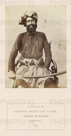 Portrait of an unknown man with a saber from the Tanoli tribe of Hazara, Khyber Pakhtunkhwa, Pakistan, photograph, page, inscription: 'TANAOLEES., AFGHAN FRONTIER TRIBE., SOONNEE MUSSULMAN., HAZARA.', number: '(241)', Hazara, c. 1862 - in or before 1872, photographer, paper, albumen print, height 113 mm x width 83 mm, human races, peoples, nationalities, hacking and thrusting weapons (with NAME), A sepia-toned portrait of a bearded man seated on a chair, wearing a wrapped turban and a long-sleeved tunic with visible vertical folds, a sash tied around his waist with fabric draped over his lap, his hands resting on a curved object across his knees, and a faint textured background.