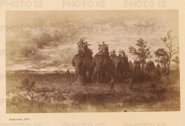 L'Incendie de la Jungle, Photo reproduction of L'Incendie de la Jungle by Jean Baptiste Robie, photograph, reproduction, page, photographer: Alexandre, after painting by Jean Baptiste Robie, c. 1878 - in or before 1883, paper, albumen print, height 92 mm x width 155 mm, behind cover, trunked animals: elephant, forest fire, A sepia-toned landscape showing a line of large elephants seen from behind moving across a grassy plain under a cloudy sky, each elephant carrying a raised platform with figures on top holding long spears or poles, smaller human figures walking alongside and in front of the elephants, scattered trees on the right side of the scene, textured clouds filling much of the upper area and low vegetation in the foreground.