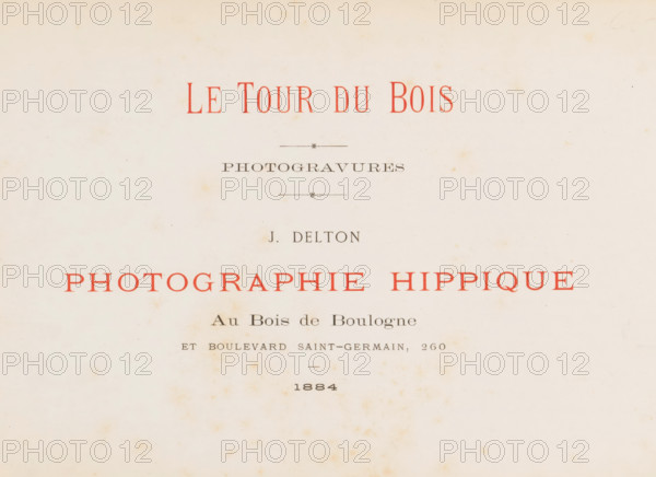 Le tour du bois photogravures, book, photographer: Jean Delton, 1884, textile materials, pasteboard, linen (material), paper, photoaquatint, height 215 mm x width 320 mm x thickness 20 mm, A cream-colored paper sheet with scattered light brown spotting and aging marks, featuring a centered layout of printed lines and decorative short horizontal rules, some printed in faded red ink and others in dark gray, with varying font sizes and spacing, and a larger block of red text spanning across the middle, all set against a slightly uneven off-white background.