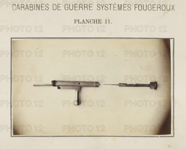 Safety catch of a rifle in two parts, photograph, page, number: 'Planche 11.', inscription: 'Carabines de guerres systèmes Fougeroux', photographer: Edouard Magis, Liège, c. 1857 - in or before 1867, paper, albumen print, height 158 mm x width 96 mm, Image in section at the back., firearms: rifle, A faded photograph shows a disassembled metallic tool or firearm component mounted against a light, aged background with a thin dark border. The left piece resembles a short cylindrical barrel with a protruding rod and a small squared opening, attached to a grip with a rounded handle. The right piece consists of a slender rod attached to a textured cylindrical cap and a spring-like section, aligned horizontally opposite the left component. The background has subtle stains and small spotting, and a rectangular frame surrounds the central image.