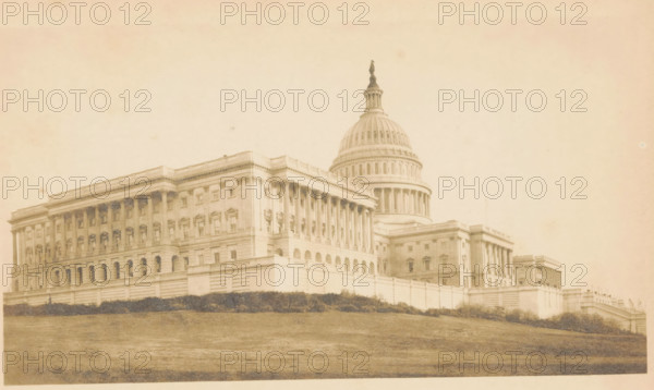 The Capitol in Washington, View of the Capitol in Washington DC, photograph, page, company name: 'Nepera Chemical Company', inscription: 'Épreuve tirée sur Carbon Velox', Capitol (Washington DC), c. 1896 - in or before 1900, photographer, North America, Washington DC, District of Columbia, paper, daylight gelatin silver print, height 125 mm x width 225 mm, national government, façade (of house or building), A large neoclassical building with a central dome and a statue atop it sits on a gently sloping grassy foreground, with a long colonnaded facade featuring rows of windows and decorative cornices, balustrades along the roofline, arched openings at the lower level, and a retaining wall with shrubbery at its base; the image has a faded, sepia-toned appearance.