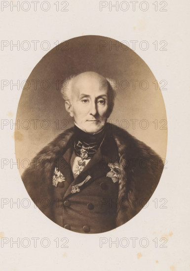 Portrait of an unknown man, photograph, page, c. 1849 - in or before 1854, photographer, paper, salted paper print, height 131 mm x width 101 mm, historical persons, adult man, An oval sepia-toned portrait of an older man with a high forehead and thinning hair swept back, wearing a dark double-breasted coat with a fur stole draped over one shoulder and ornate medals and decorative brooches on his chest, set against a plain light background.
