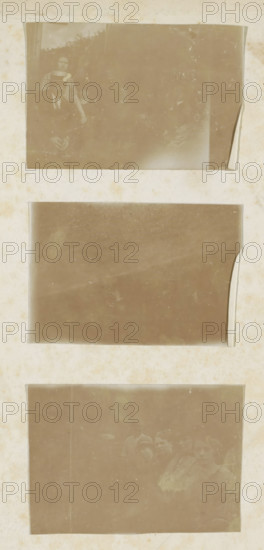 Revue spirite, book, printer (person): Rouge, Dunon et Fresné, Paris, compiler (person in literature): Pierre-Gattan Leymarie, 1874, printer (person), compiler (person in literature), textile materials, pasteboard, paper, linen (material), printing, albumen print, agate marbled paper, height 241 mm x width 160 mm x thickness 25 mm, A vertical sheet with three rectangular sepia-toned photographic slots arranged top to bottom, each slot showing faded, scratched surfaces and slightly curled edges; the top slot contains a faint group portrait with a person wearing a hat and others partially visible behind, the middle slot is largely blank with smudges and worn corners, and the bottom slot shows a faint scene of several people with indistinct faces and clothing; the surrounding sheet has an aged, spotted texture with discoloration and subtle stains.