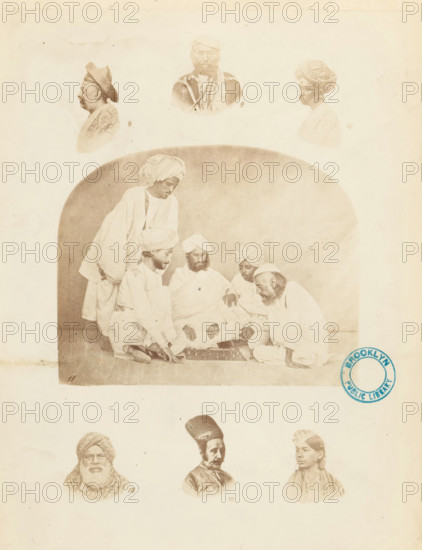 Collection of portraits and a company of Indian men illustrating various types of turbans, Turbans. ornamented, &c., photograph, page, inscription: 'PL. II., Costume-Illustrations', collector's mark: 'Brooklyn Public Library', printer (person): William H. Griggs, c. 1861 - in or before 1866, William H. Griggs, photographer, printer (person), paper, albumen print, height 260 mm x width 205 mm, historical persons, head-gear: turban, A sepia-toned image shows a large central scene of men seated on the floor around a low board, with turbans and loose robes, one man leaning forward and another standing behind them within a rounded-arch backdrop. Above this scene are three portrait busts of men facing different directions, each with distinct headwear. Below the central scene are three more portrait busts of men arranged in a row, each with different facial hair and head coverings. A circular blue stamp appears near the right edge overlapping the central scene. The page has a pale background ...